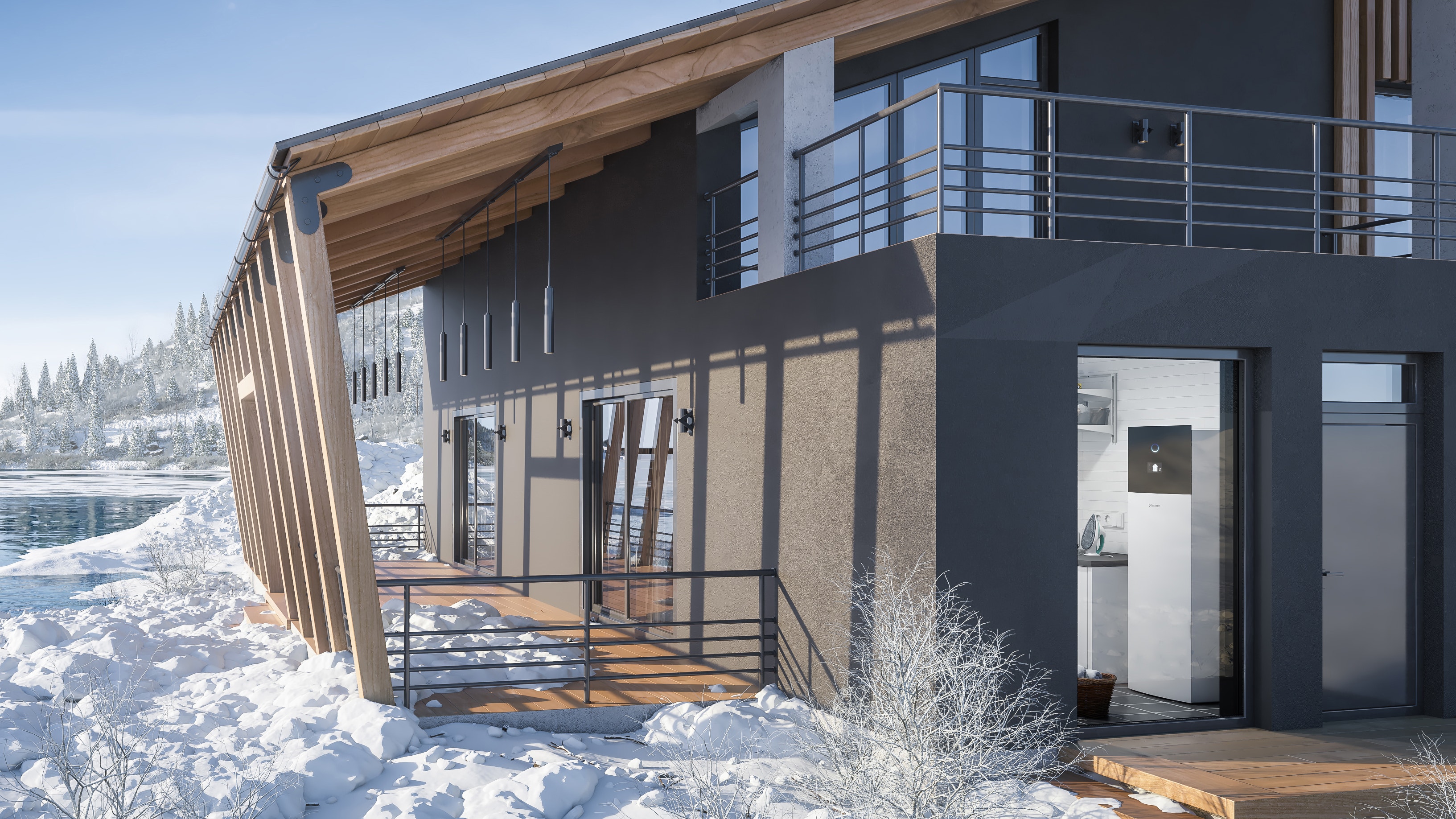 Modernt hus i snölandskap, som är perfekt uppvärmt av Daikin
